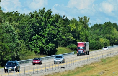 Truck-amid-cars-on-highway-soft-focus-2018-12-03-13-12