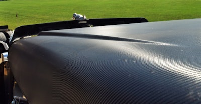 An interesting approach to paint preservation is well evident on the hood and fenders, where a textured carbon-fiber wrap covers the rig’s surface.