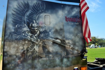 Airbrushed murals all around the cab and sleeper exteriors of this 2007 Coronado depict the Husaria, or Polish Hussars, of the 16th-18th centuries. This driver-side-sleeper illustration makes explicit the intention of owner-operator Jerry Stetz to draw the line between the ancient defenders/warriors and modern combat soldiers fighting for what is his home today and for the last 20-plus years, the United States.