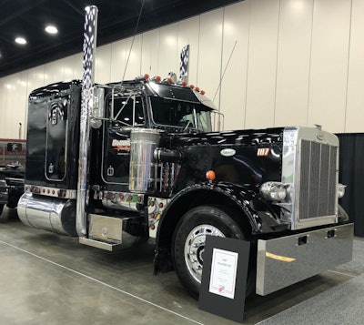 Dave Stewart, from Lafayette, Indiana, owns this 1987 Peterbilt 359. It has a 4 1/4 CAT and 15-speed transmission.