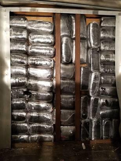 CBP officers found more than 1,200 pounds of marijuana behind a false wall in a trailer. (CBP photo)