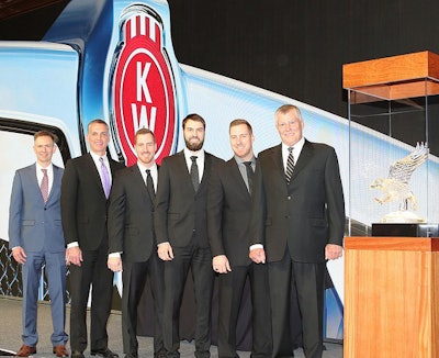 The KW Maska team accepting the dealer award, with KW reps, from left: Kevin Baney, Kenworth assistant general manager for sales and marketing; Mike Dozier, Kenworth general manager and Paccar vice president; and Kenworth Maska executives Nicolas Letendre, Sébastien Letendre, Samuel Letendre, and Pierre Letendre.