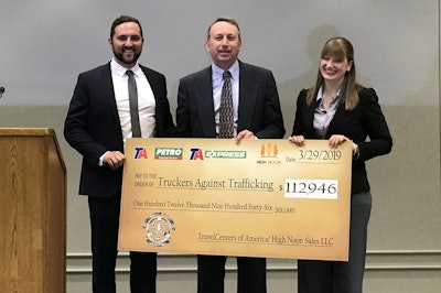 TravelCenters of America presented a check Friday to Truckers Against Trafficking with the proceeds from TA’s campaign to sell TAT gear with $1 per purchase going directly to TAT. Pictured left to right are Justin Hoffman with High Noon Sales; Tom Newbould, senior vice president of retail merchandising at TA; and Helen Van Dam, director of TAT’s Freedom Drivers Project.