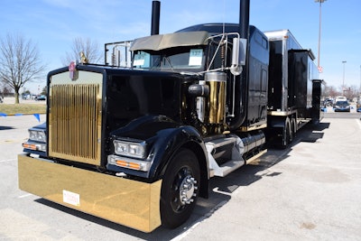 Dan and Tracy Kaderabek of Badass Trucking and Badass RV brought this Kenworth 1995 W900 to MATS. It features not only a spacious, solar-powered customized RV trailer but stunning gold-colored stainless from the front end through parts of the trailer.