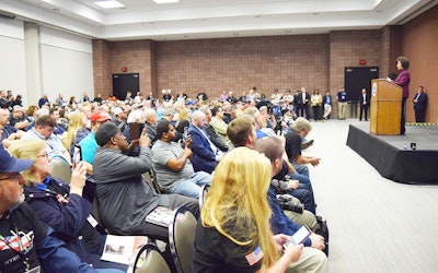 Chao, flanked by FMCSA Administrator Ray Martinez, announced the DOT’s decision to proceed with an HOS overhaul in front of a packed house at MATS.
