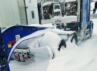 Owner-operator Ater’s tractor at a certain point in the three-night sojourn at The Junction. Blowing snow in the flat landscape created monster drifts in other spots. In the podcast, too, Ater describes how the wind filled the space behind his 2000 FLD’s front bumper with snow when it got particularly bad.