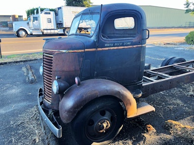 The picture shows Salmon’s 1940 Chevy COE work truck (Salmon plans to put a car hauler body on it), with the owner-operator’s working W900 in the background.