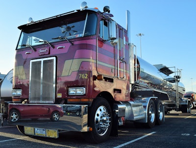 The tankers of the fleet Mike Landis hauls for with this 1999 Peterbilt 362 are mostly single-bore stainless-steel insulated trailers. Their step-up catwalks are designed for maximum safety. From their lower platforms, Landis can do much of the work required at the top of the tank without the need to climb up to the top catwalk.