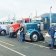 Six trucks with drivers posing-2019-05-20-15-12