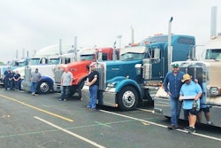 Six trucks with drivers posing-2019-05-20-15-12