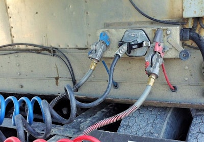 The VSA PlugSaver installed with the tractor turned at a hard angle to the right, illustrating its ability to firmly hold the pigtail against forces that could wiggle it loose or otherwise interfere with the connection.