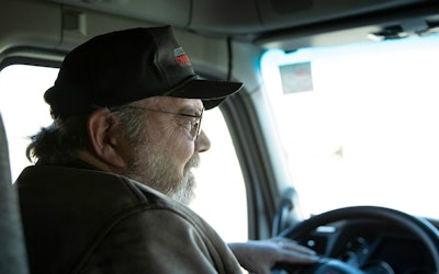 Trucker-songwriter Will Belley at work behind the wheel | photo courtesy of Thompkins Square