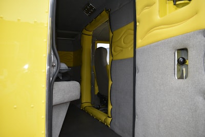 The truck’s interior features yellow paneling to match the exterior of the unit.