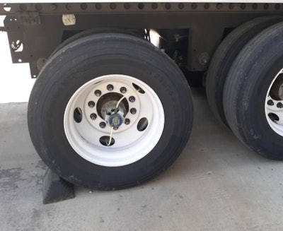 Tommy Bryant, with this pic, seconded that notion, though most locations will chock the wheels themselves if he doesn’t first when the trailer’s in place.