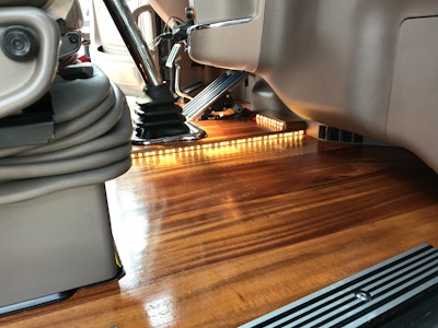 The interior features LED accent lighting that changes from amber to purple.