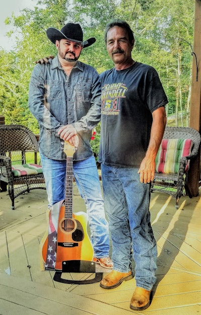 Small fleet owner Les Willis (right) with [the real?] Tony Justice.