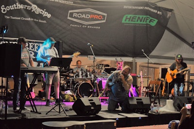 Editor’s note: Sponsors of the entertainment at the TA Petro Truck Parking Community at GATS were a big part of making the festivities happen this year, with another record haul for truckers’ benefit auction, and more, for the St. Christopher Truckers Fund nonprofit. Paul Marhoefer, pictured above with the Stone Creek Four on Thursday night on the stage at the parking community, performed every night, along with numerous others throughout the three show days. | Picture by Todd Dills