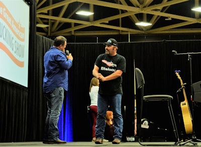 Barker just after learning he’d won and greeting Tony Justice onstage. His winning performance was of a Zane Williams song called “While I was away.”