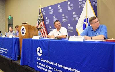 FMCSA Administrator Ray Martinez (second from right) heard feedback from owner-operators and other industry stakeholders in a listening session at the Great American Trucking Show on Friday, Aug. 23, alongside Jack Van Steenburg (far right), Wiley Deck (far left), Jim Mullen (second from left) and Larry Minor (behind the podium).