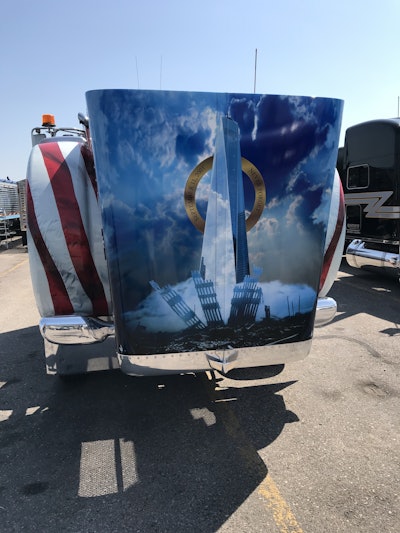 The hood features an image of One World Trade Center rising up out of the rubble from the attacks.