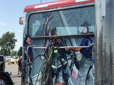The back of the cab shows firefighters after 9/11 raising the American flag.