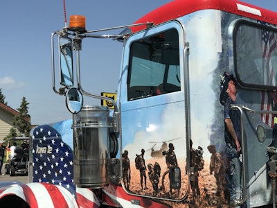 The driver’s side of the cab shows the military overseas after the 9/11 attacks.