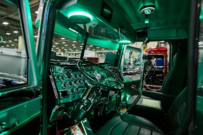 They completely disassembled the interior and redid it, including smoothing out the dash; adding custom leather seats, a custom overhead to conceal the CB and custom lighting; painted and clear-coated the floors and more.