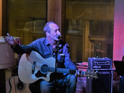 The evening of Wednesday, October 30, singer-songwriters gathered in Lindsay Lawler‘s Music Loft event space in downtown Nashville, blocks from the NASTC conference hotel, for a dry run through songs for the Saturday Grand O’ Trucking Show. Songwriter Troy Martin (pictured) will sing a tune co-written with none other than NASTC’s David Owen — “The Bills Don’t Wait.” The bills don’t wait / The road goes on / Got miles to make / But at least I’m gone…