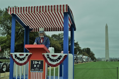 The scene this morning. 10-4 organizer Fred Bowerman brought along a ridealong passenger in his cabover: Uncle Sam here and the podium in a trailer along with other gear “in case anyone wanted to speak.”
