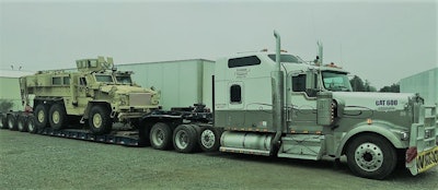 Owner-operator Workman hauls in this 1999 Kenworth W900L powered by a relatively rare 16-liter Cat factory 600 motor, he says.