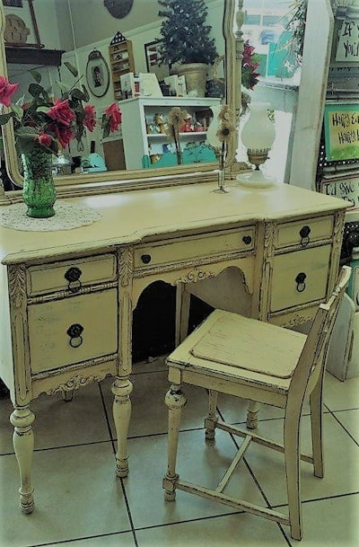 Taylor came to a complete stop alongside the piece as Cherie and friend motored away. “Is she going to come back?” his friend said. Taylor: “Nah, we’ll catch up with her. I’ve got to pick up that vanity right there.” What you see above: What the piece looked like after Cherie was through with it.