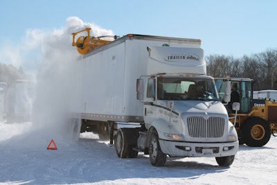 TrucBrush attaches to a loader and scrapes at 200 rotations per minute with a polypropylene broom to remove both ice and snow from trailer roofs.
