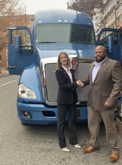 Campbell in front of his new Kenworth T680 with Lisa Berreth, Kenworth marketing director.