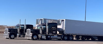 The 2019 Cummins-powered flattop 389 and the 2015 model of Rick and Lisa Weddle, before the accident. When it occurred, the 2015 was hooked to “Rick’s baby,” Lisa says, the 2013 Great Dane stainless spread-axle reefer also pictured. The owner-operator couple happened to be on a rare team run after some time running these rigs in tandem out to California and back to Missouri. The pair live in Union, Mo.