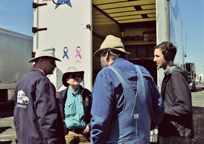 Among owner-operators featured in Episode 1 are expediters Stephen Halsted and Sandra Goche (left), second-career haulers who’ve taken an active role in helping to build out the information underpinning the Dock411 mobile app for crowd-sourcing dock-location information. Also pictured, from right: “Over the Road” producer Ian Coss and host “Long Haul Paul” Marhoefer.