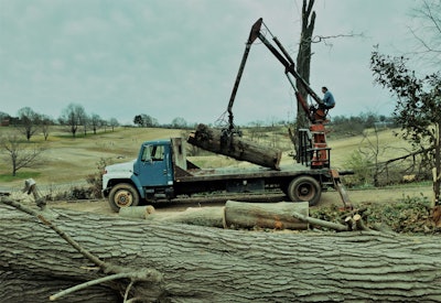 Along for the ride that day with Kohler in the truck, powered by a DT467 in-line six diesel — you’ll see if you look closely — is his dog, Scout. The golf course, minus a former huge stand of trees that were in the tornado’s path, you see here in the background.
