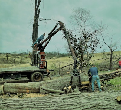 Guys had been slowly struggling with a trunk laid parallel with the driveway for at least an hour. When Kohler got out of his truck, it was all of about 15 minutes, tops, before he had the whole thing on the flatbed to cart out of the yard elsewhere.