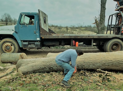 He pulled the truck down the driveway, as shown above, and pulled his own more sizable chainsaw from the storage box under the flatbed — what followed reminds me one of owner-op Mike Landis’ observations in Over the Road’s first episode. Landis likened a pro highway captain at work on the road to a virtuoso guitarist plying his trade onstage, “in his zone.”