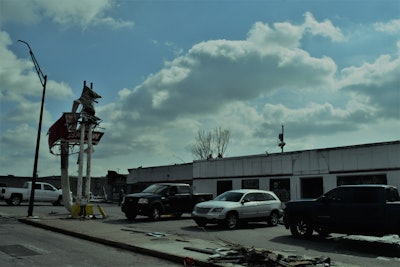 Arterials through East Nashville if you’re delivering in the area remained closed this morning — chiefly Gallatin Ave./Main Street near to downtown (pictured is a business on Main in the direct path of the tornado near 7th/8th streets, in the process of clearing internal and external damage). Crews were on the scene working on power lines, traffic lights and the like, as businesses along the route picked up. For areas east of town, check local Twitter feeds and other resources for local roads — major interstates appear to be as of now unaffected.