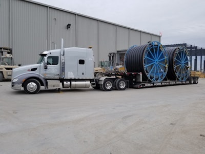 Semi truck hauling heavy duty equipment