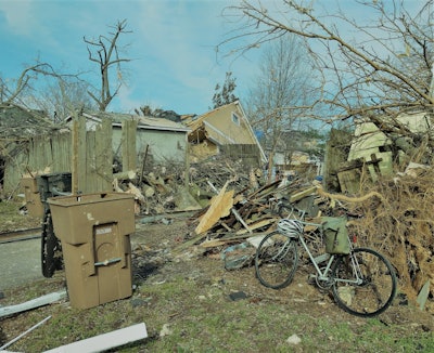 In any alleyway between Holly and Fatherland streets, where I pedaled Tuesday and ended up helping clear the area around a house with minor damage, between two that lost their roofs and would likely eventually be demolished.