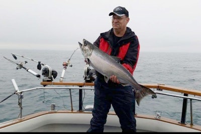 Kocmich likes to schedule time for a salmon fishing trip and a deer hunting trip each year. He caught this salmon while out with his friend, Russell Voss, on Lake Michigan.