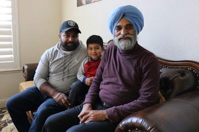 Binda Atwal (pictured, left) tells his own and his family’s story in trucking. His father, Gurmail, immigrated to the United States from India’s Punjab region, just preceding a wave of immigration from there that began in the 1980s. Also pictured: Binda’s son, at their home in Atwater, California.
