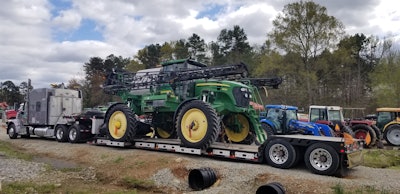peterbilt truck carrying tractor