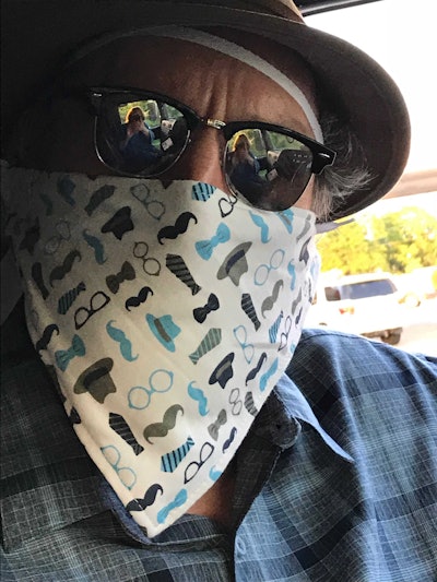 Our own Paul Marhoefer was using a more proper mask at truck stops and shipper/receiver sites hauling when it outlived its useful life, at least without some necessary cleaning/rehabilitation — so “we bought some baby bibs in Mississippi,” he says, here pictured.