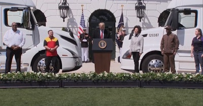 President Trump spoke Thursday in an address on the White House lawn to express appreciation to U.S. truck operators. From left: Big G Express driver Steven Richardson, DHL Express driver Dylan Mattigan, Trump, DOT Secretary Elaine Chao, UPS driver Charleton Paul and Fed-Ex owner-operator Tina Peterson.