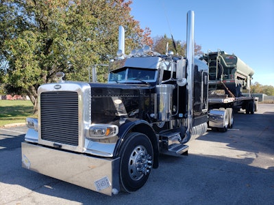 Darrell Muller spent much of Saturday and Sunday parked on Constitution Ave. with other truckers. He runs in this 2013 Peterbilt 389 with a long stretched frame that allows the pair the ability to haul 60-foot beams on their flatbed and mostly avoid the cost of oversize permits, and “still get the oversize rates,” with minimal flagging, Darrell said. In short, they’ve carved their niche as a way through the downturn here working mostly with what he says is a good broker in Material Logistics Management. At once, Darrell said that load availability is such that it’s gotten to where they sit a good deal longer waiting than has been customary. He does feel, too, that some additional oversight mechanism is needed, generally, to make the herky-jerky spot market a more fair vehicle for truckers to do business within. That message, among others, appears to have galvanized some of those involved in demonstration actions around the country these past weeks, as market dynamics have turned hard against them in negotiations, given not enough freight to go around.