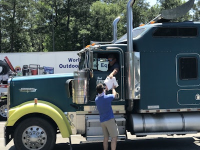 Chick-fil-A and Randall-Reilly employees handed food to drivers as they passed through the rest area.