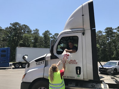 Chick-fil-A and Randall-Reilly employees handed food to drivers as they passed through the rest area.