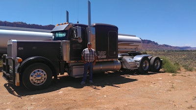 Kevin Irvine and his 2005 Peterbilt 379. Irvine owns and operates a six-truck tanker fleet out of Moab, Utah. The fleet hauls fuel and milk. The fuel loads “slowed down and then came to a stop” in the recent downturn, said Irvine, but the fleet has been able to pick up extra loads of milk to make ends meet. Irvine said he’s taken a salary cut to keep up with expenses like driver wages, insurance premiums and equipment payments. After a few weeks of hurdles, he was able to secure payment deferments on loans for two trucks and two trailers.